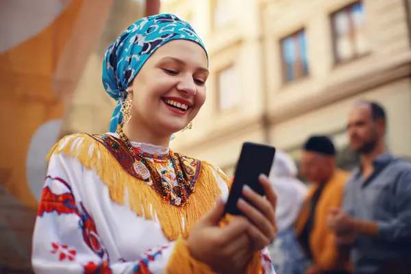 A stylish woman beside vibrant slot machines displaying glowing sevens, showcasing the variety of top slots at 777D.